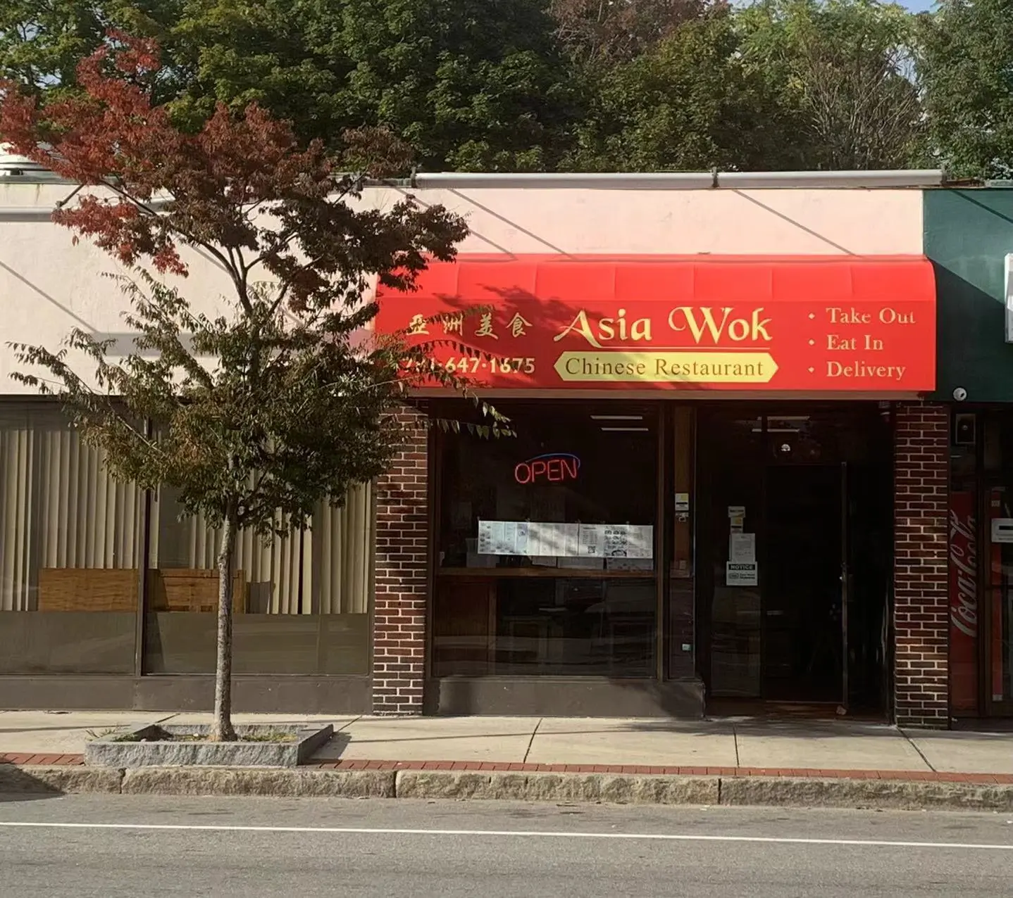 Asia-Wok-Chinese-Restaurant-Restaurant-Exterior-Waltham Exterior with red awning and "Asia Wok" signage at Asia Wok, a Chinese Restaurant in Waltham